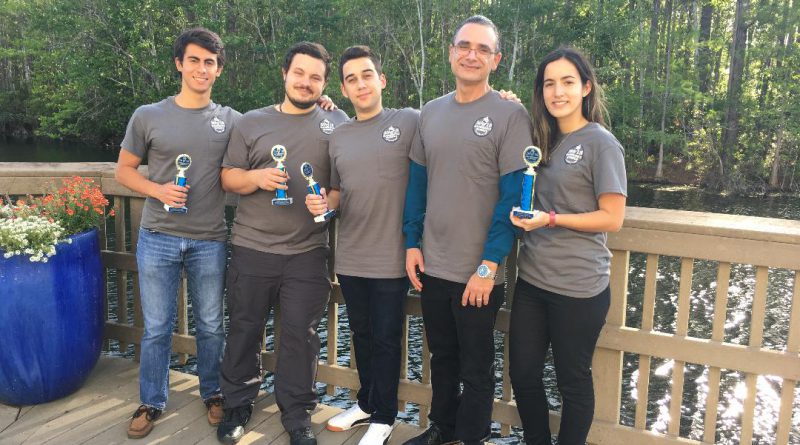 The Mathematics Club posing with their awards.